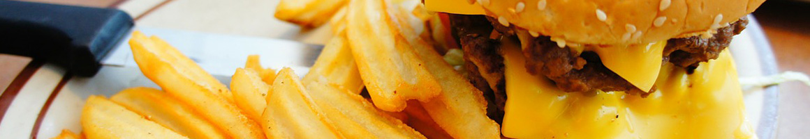 Eating Burger Fast Food at Dick's Drive-In restaurant in Seattle, WA.